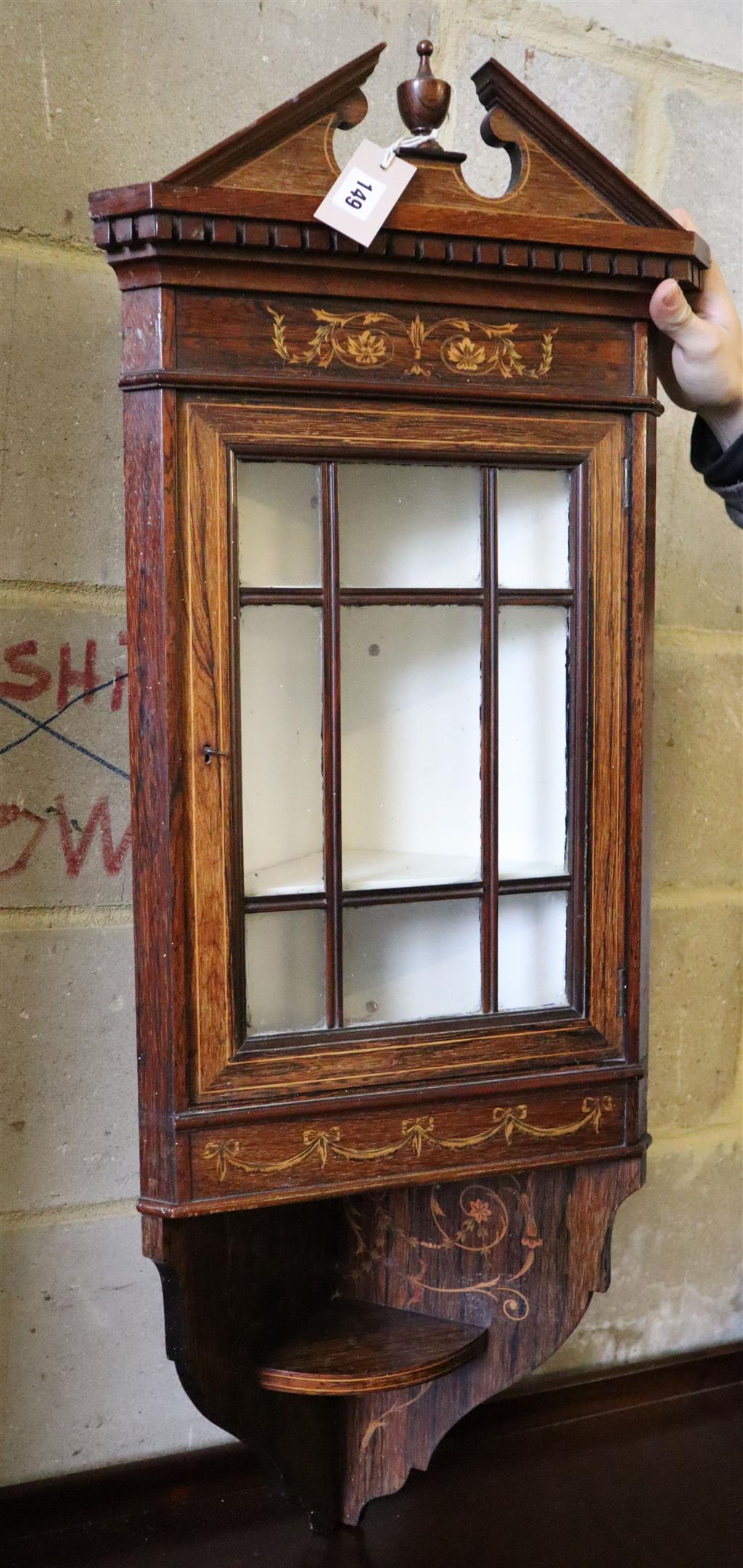 A small Edwardian inlaid rosewood hanging corner cupboard, width 38cm, depth 24cm, height 104cm